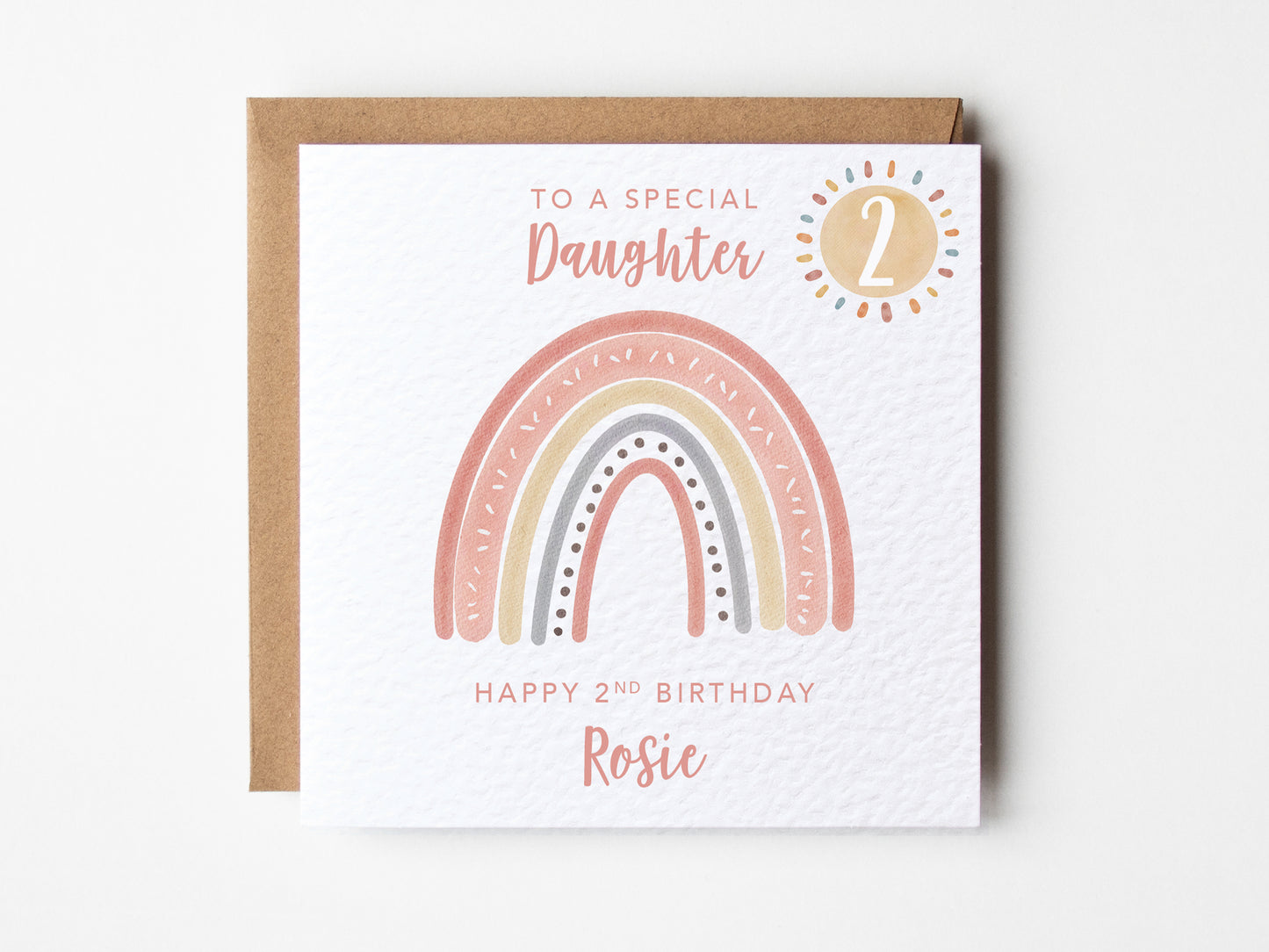 Birthday card  with rainbow design and personalised text on a white background.