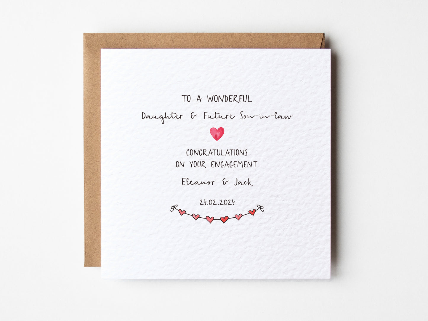 Engagement card for a wonderful daughter and future son-in-law with a heart design on a white background.