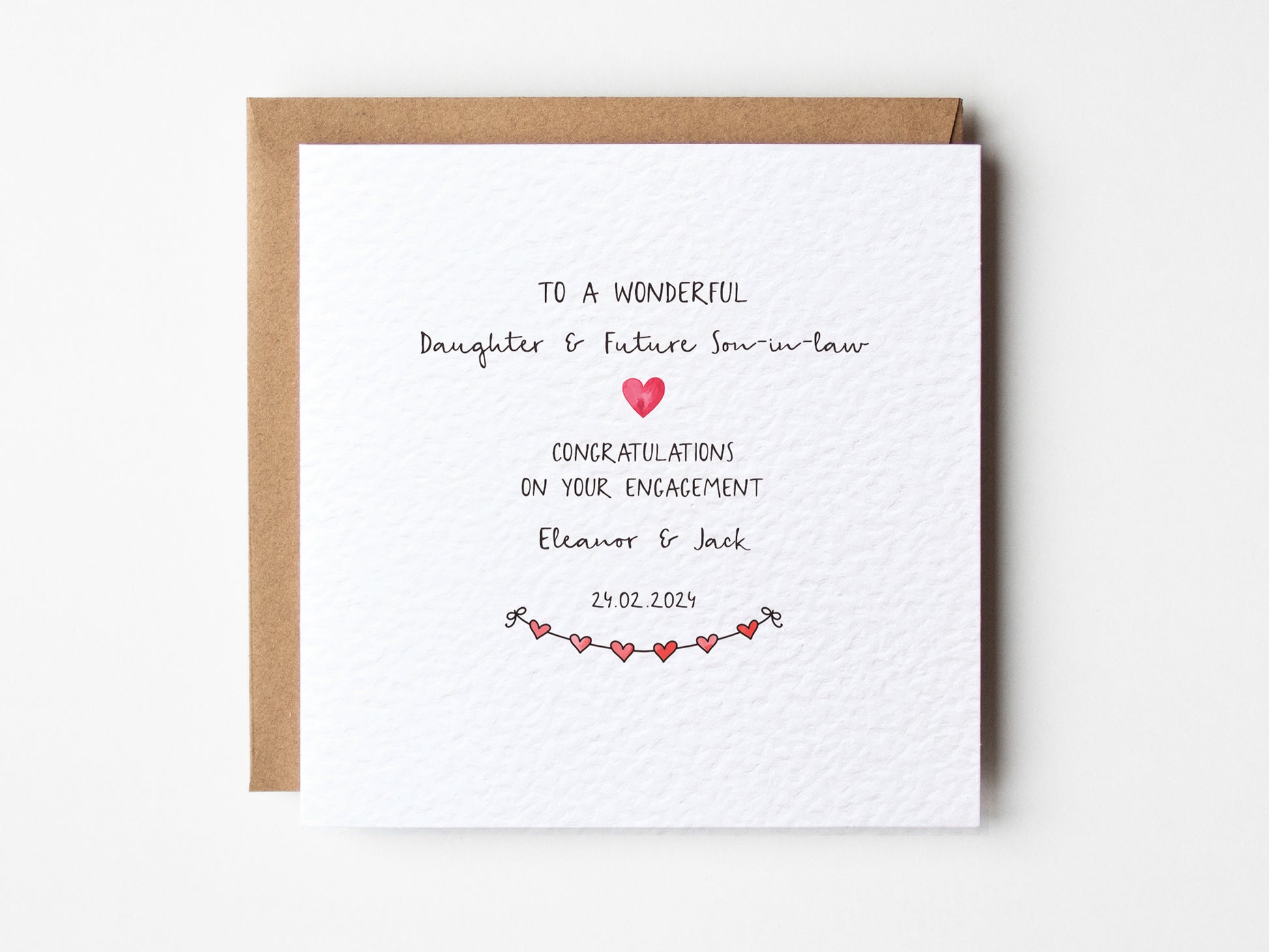 Engagement card for a wonderful daughter and future son-in-law with a heart design on a white background.