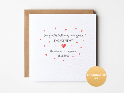 Engagement card with red hearts and personalized text on a white background