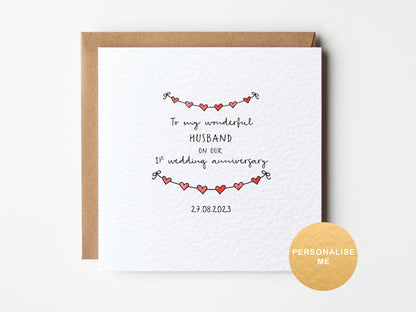 Personalised 1st wedding anniversary card for husband with red heart garland design and custom date, romantic paper anniversary card