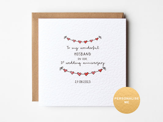 Personalised 1st wedding anniversary card for husband with red heart garland design and custom date, romantic paper anniversary card